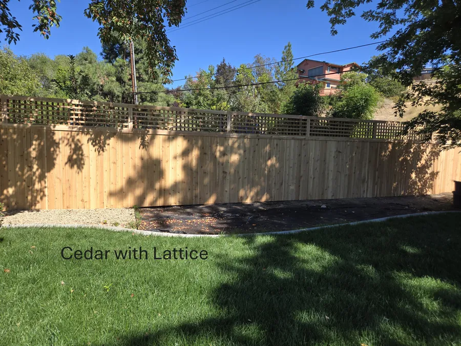Cedar privacy fence with a lattice top enclosing a Boise backyard lawn