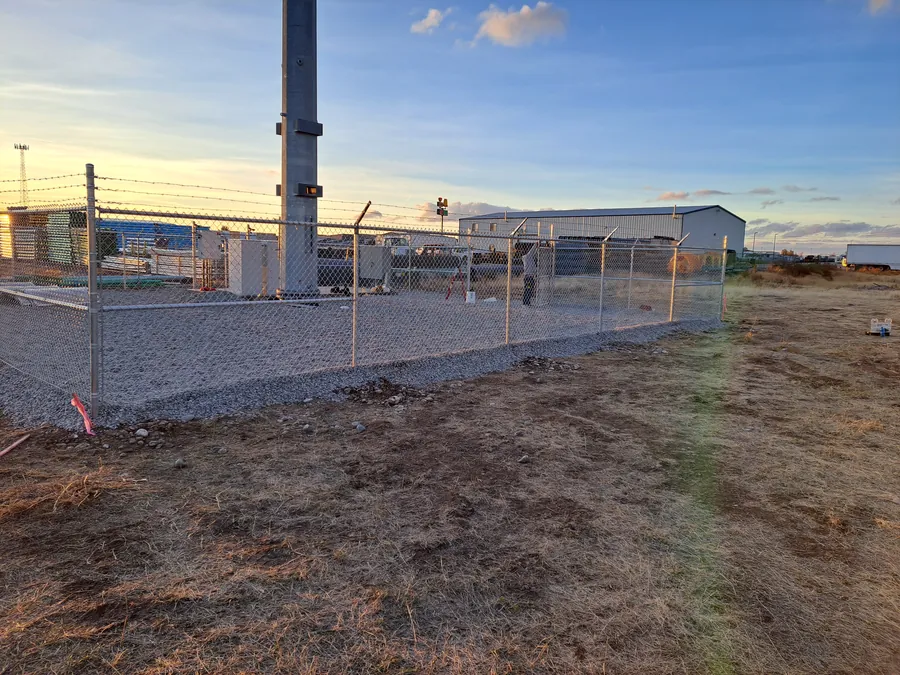Chain link fence enclosing a utility yard in the Treasure Valley