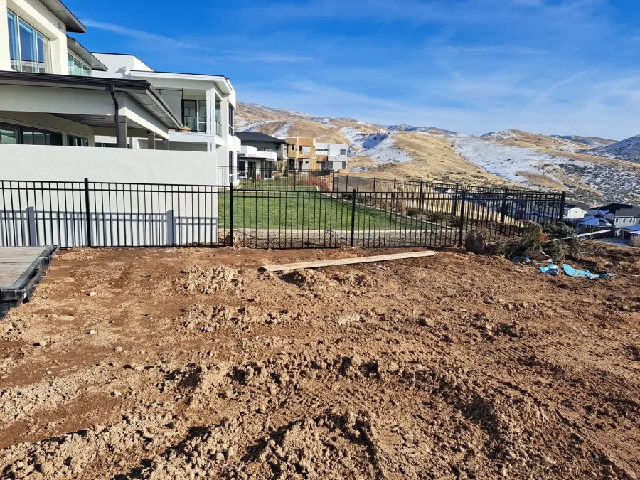 Western three rail iron fence at a newly built Idaho home