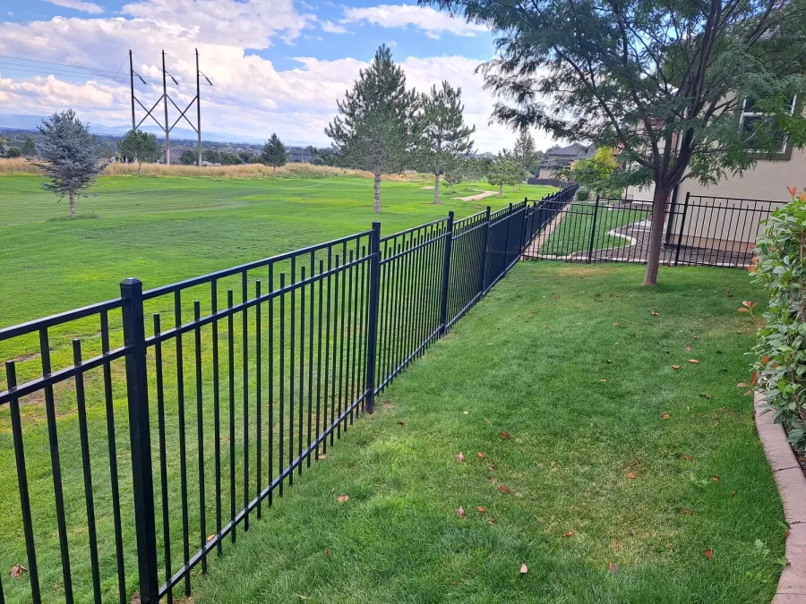 Staggered vista wrought iron fence running along a Boise, Idaho property with the foothills behind it